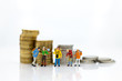 © polymanu - Miniature people : Tourist group go to travel the places and have expenses for tourism. Image use for travel business