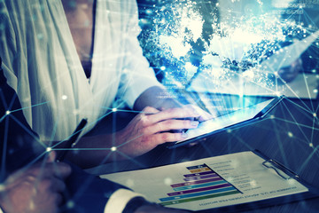 Businessperson in office connected on internet network with tablet. concept of partnership and teamwork