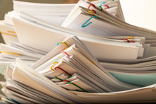 Stack Of Document Paper With Colorful Paperclip.