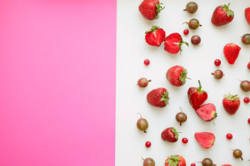 Wall Mural - Red strawberry berries on a white background, top view