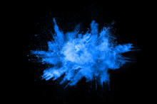 Abstract Blue Powder Splatted Background,Freeze Motion Of Color Powder Exploding/throwing Color Powder,color Glitter Texture On Black Background.