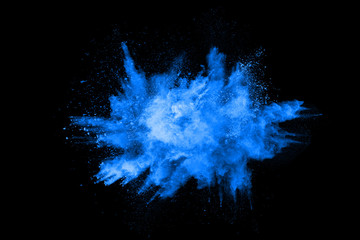Canvas Print - abstract blue powder splatted background,freeze motion of color powder exploding/throwing color powd