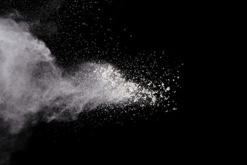 Wall Mural - white powder explosion on black background. colored cloud. colorful dust explode. paint holi.