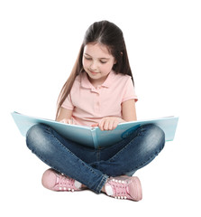 Wall Mural - Cute little girl reading book on white background