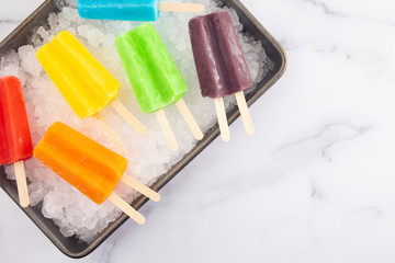 Rainbow Two Stick Popsicles in a a Box of Ice