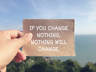Wall Mural - Motivational and inspirational wording - If You Change Nothing, Nothing Will Change. Blurred styled background.