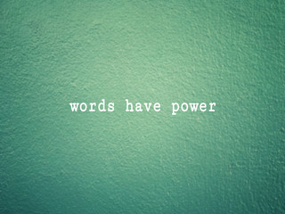 Wall Mural - Motivational and inspirational wording - Words Have Power written on green background.