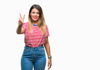 Young beautiful woman casual look over isolated background showing and pointing up with fingers number two while smiling confident and happy.