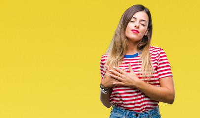 Sticker - Young beautiful woman casual look over isolated background smiling with hands on chest with closed eyes and grateful gesture on face. Health concept.