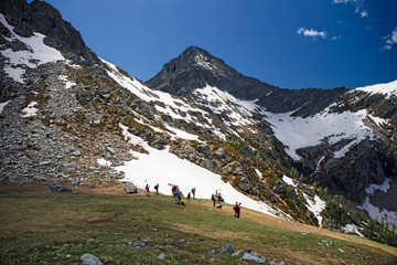 Wall Mural - hikers near the forca di larecchio in piedmont, italy.