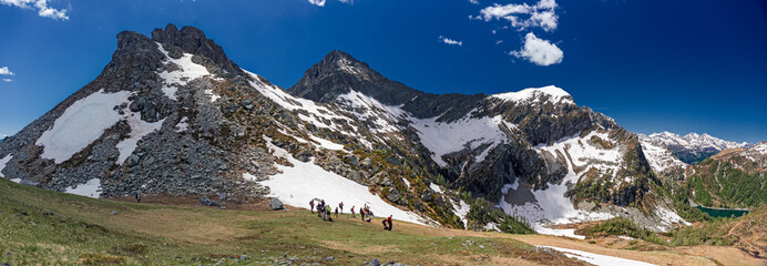 Wall Mural - hikers near the forca di larecchio in piedmont, italy.