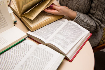 Wall Mural - hand of a woman on old book