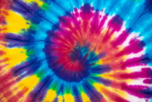 Tie Dye Spiral Vibrant And Gradient Rainbow Multicolor , Hippie Shirt Pattern . Abstract Fabric Texture And Background .