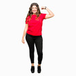© Krakenimages.com - Young beautiful woman wearing casual t-shirt Strong person showing arm muscle, confident and proud of power