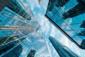 Wall Mural - Clouds rush over skyscrapers