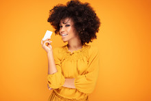 Afro Girl Holding Credit Card In Hand.