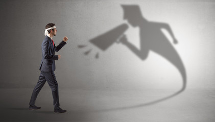 Canvas Print - Businessman fighting with his bossy yelling shadow
