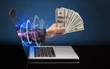 © ra2 studio - Hand with money coming out of a laptop with sparkling effects