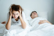 Snoring may cause apnea. May cause death. Caucasian couple That the wife must endure the behavior of her husband, snoring every night Causing poor mental health There may be problems in family life.