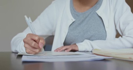 Wall Mural - Woman write on the paper, study at home