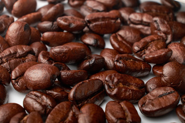 aromatic roasted coffee beans on white background