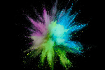 Wall Mural - Colored powder explosion. Abstract closeup dust on backdrop. Colorful explode. Paint holi