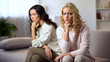 © motortion - Two offended young woman sitting on sofa, worry about quarrel with best friend
