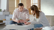 © motortion - Unhappy couple calculating income and expenses of family budget, unemployment