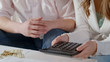 © motortion - Middle-class couple calculating monthly payments, low family budget, bankruptcy