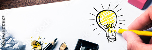 Fotomural Hand Drawing Light Bulb On Paper - Bright Idea Concept