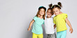 © FAB.1 - shot of three children in bright clothes, two girls and one boy. Triplets, brother and sisters.