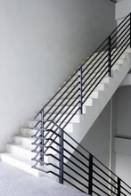 Stairway With Black Metallic Banister In A New Modern Building Architecture