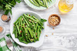 © Nelea Reazanteva - Sauteed green beans with pine nuts in a baking dish, healthy side dish.
