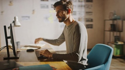 Wall Mural - Designer Sitting at His Desk in Office Studio Working on a Desktop Computer with Smartphone Software Development Application on Screen. Energetic Fast Paced Time-Lapse. 360 Degree Tracking Arc Shot