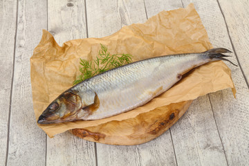 Salted herring over the wooden board