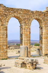 Wall Mural - Arches at the ruins of Volubilis, ancient Roman city in Morocco.