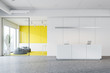 © ImageFlow - White and yellow office reception and waiting area