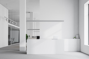 White reception desk in office interior