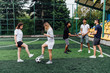 © Тарас Нагирняк - A group of friends in casual outfit play soccer in the open air. People have fun and have fun. Active rest and scenic sunset.