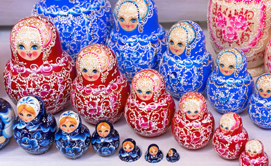 Wall Mural - Russian wooden doll matryoshka on the counter of the gift shop. Matryoshka is a national Russian souvenir.