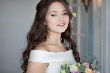 Beautiful elegant bride in white dress. A charming young woman is getting married.