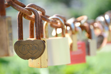 Love Padlocks On A Chain On A Sunny Day
