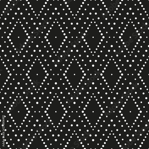Geometric ornament of rhombuses. Pattern of white dots on a black background....