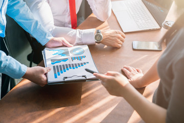 successful business meeting caucasian businessman manager white shirt red tie enjoy with result of profit from chart graph with co worker office background