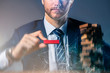 © whyframeshot - business man try to build wood block on wooden table and black background business organization startup concept