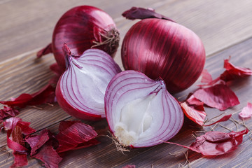 red onions on rustic wood