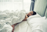 Fototapeta  - Naked woman sleep on bed at weekend