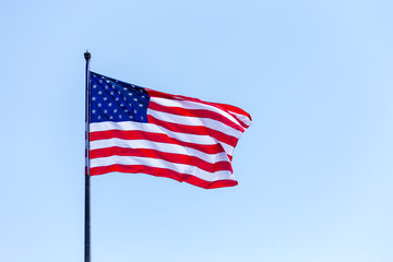 American flag on the blue sky on the wnd