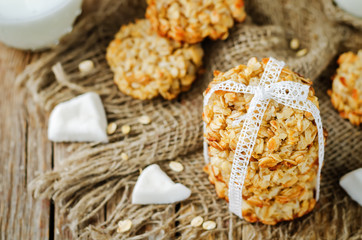 Oatmeal coconut cookies on a wood background