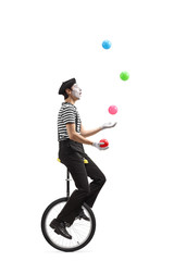 Poster - Mime on a unicycle juggling with balls